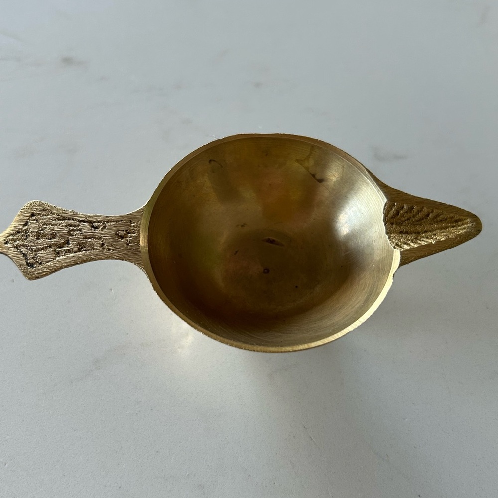 Vintage handheld brass diya ( oil lamp) .
